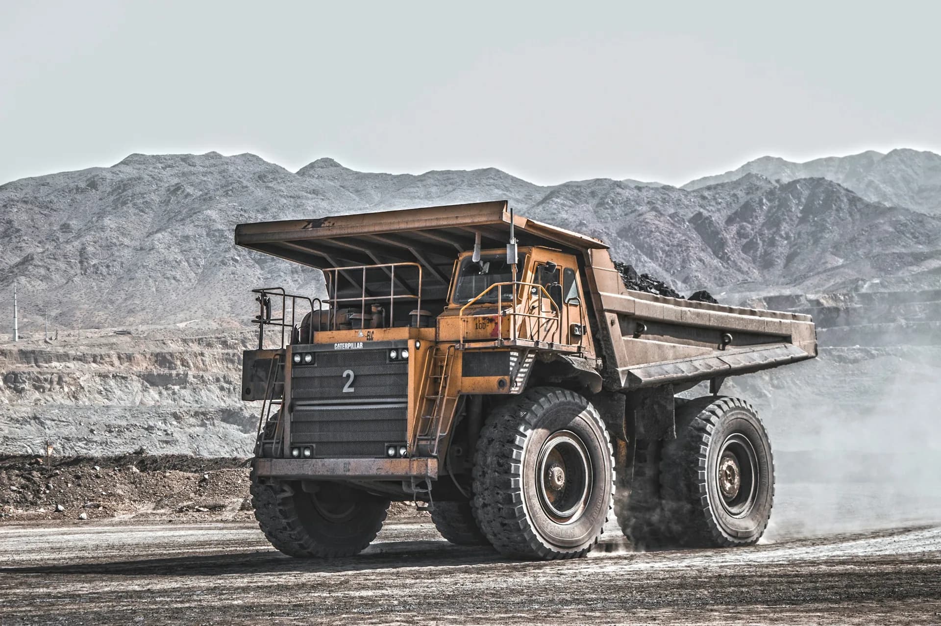 Heavy mining haul truck on a quarry road